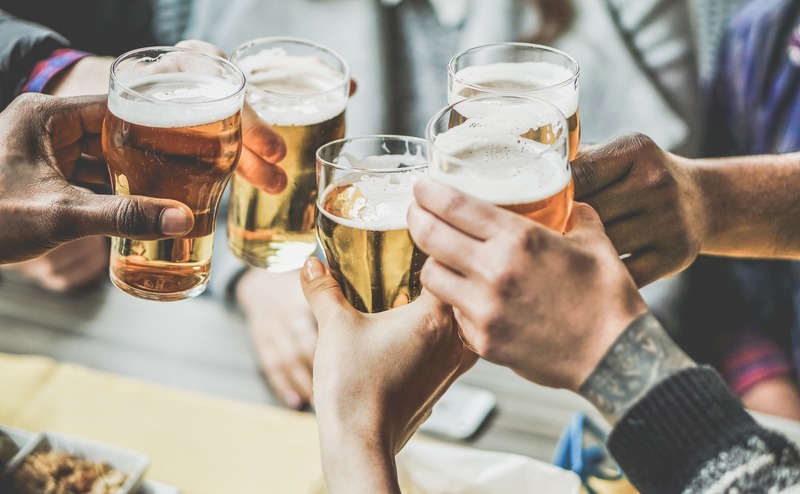 photo of beer glasses toasting