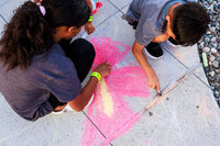 Photo: Kids adding their artistic flourish with chalk on the station plaza.