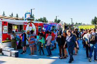 Photo: Food trucks enjoying brisk business around the dinner hour.