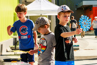 Photo: 3 young children have fun playing with bubbles.