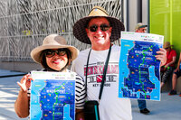 Photo: Two attendees show off their Sound Transit Discovery maps.