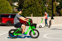 Photo: Attendee trying out a Lime bike.